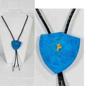 Black cord and blue stone bolo tie with copper fleck.